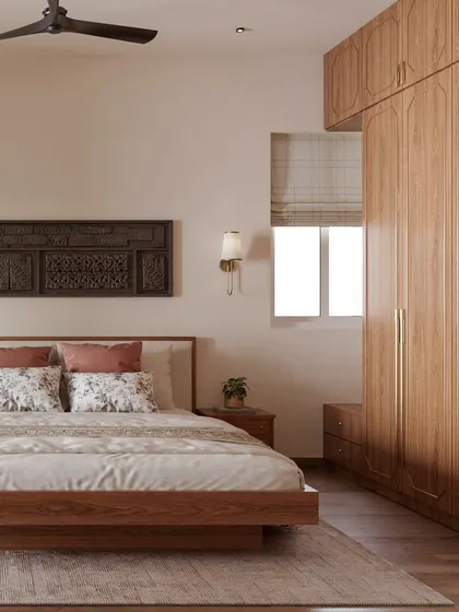 For this bedroom, I blended modern Indian aesthetics with classic comfort. The carved wooden panel above the bed adds a traditional touch, while the clean lines of the furniture and the warm wood tones of the wardrobe create a cozy and timeless feel.
