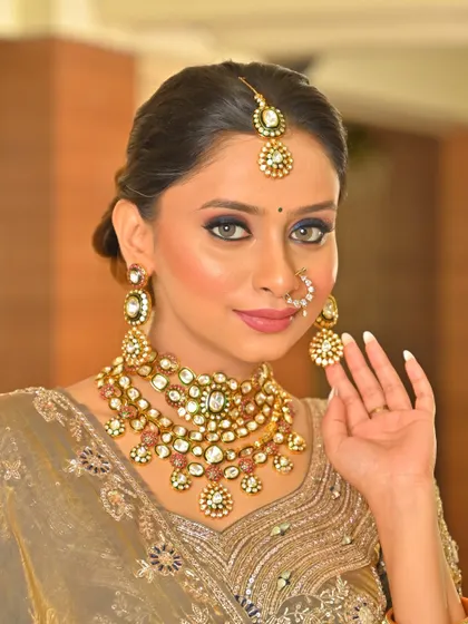 A close-up of the beautiful jewelry and how it complements the subtle makeup.
