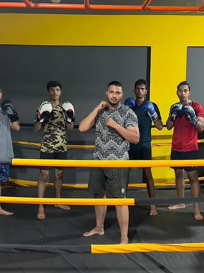 Posing with some of my fighters in the ring. I'm proud of the progress each one of them makes.