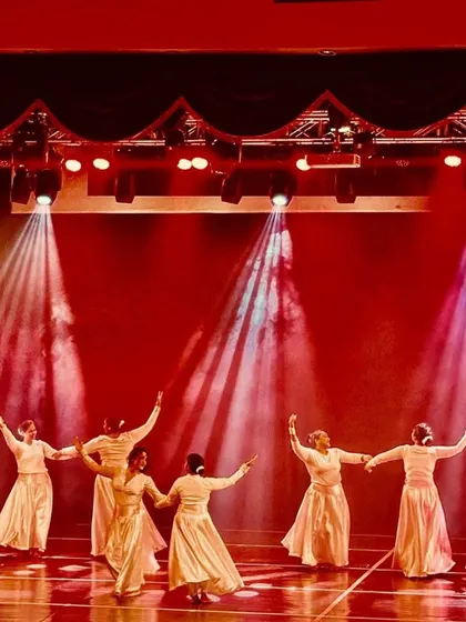 Another shot of the elegant choreography from Manch 24, showcasing the flowing movements and coordinated grace of the performers.