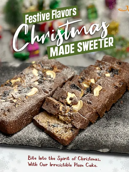Experience the taste of Christmas with our classic plum cake. This image captures two rich, dark fruit cakes, generously topped with cashews and dusted with powdered sugar, promising a moist, flavorful bite that embodies the holiday spirit.