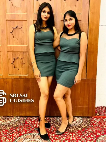 To match a more contemporary or cocktail party vibe, our hostesses can be attired in modern dresses. This team is wearing matching green peplum-style dresses, offering a chic and stylish service option for birthdays, anniversaries, and corporate mixers.