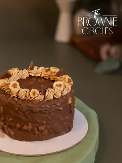 A closer look at the Chocolate Hazelnut bento cake. It's topped with roasted hazelnuts and a coffee-infused buttercream for a rich, aromatic flavour.