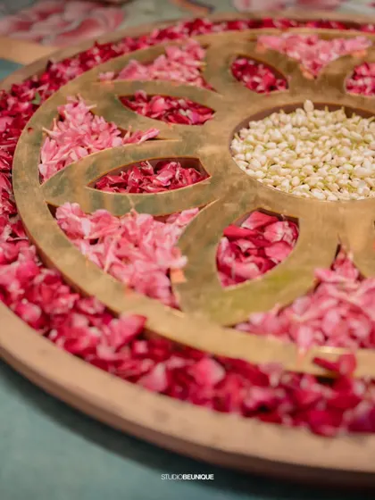 Another beautiful floral detail, with a brass plate creating a pattern over red and white petals. I believe in artistry at every level of decor.