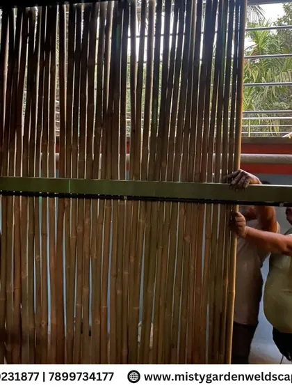 Our team installing the bamboo walls for the farmhouse structure. We use high-quality, treated bamboo to ensure durability and longevity.