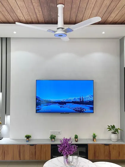 A close-up of the TV unit, which includes a glass-fronted display cabinet. This is a great way to showcase decorative items while keeping them protected and dust-free.