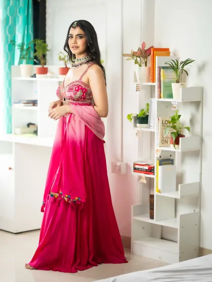 A classic pose showing the full silhouette of the sharara set. My experience helps in presenting ethnic wear in the most appealing way.