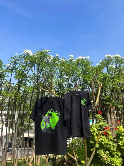 Here are the two custom anime T-shirts hanging outdoors, giving you a clear view of the front and back designs in natural light. The quality of the print ensures the design is sharp and long-lasting.