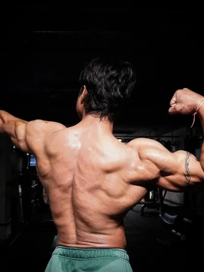 A final back pose, celebrating the journey and the struggle that builds character and muscle.