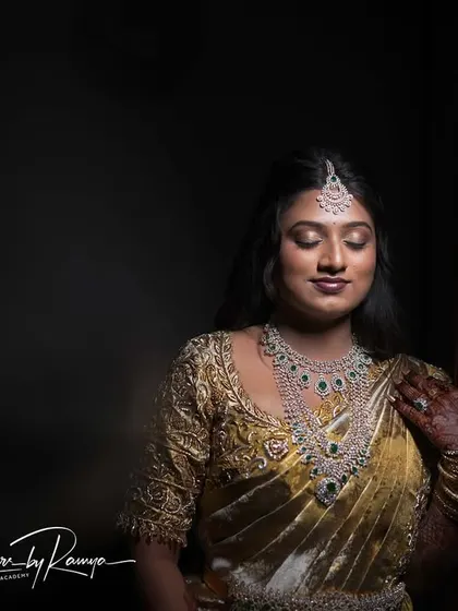 Pooja looking serene and beautiful for her reception. This shot captures the flawless finish of her makeup and the elegance of her hairstyle.