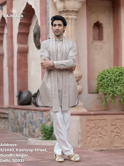 The model strikes a confident pose in the beige printed kurta. This image showcases the comfortable fit and timeless appeal of the Riwayat collection.