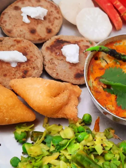 My mini samosas and bajra rotis served with a cabbage and pea stir-fry, a simple yet incredibly satisfying meal.