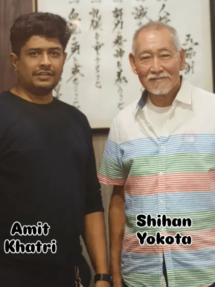 With my teacher, Shihan Kousaku Yokota. I have been his direct student for over 12 years, and his guidance in Asai-ryu Shotokan is the foundation of everything I teach. This lineage ensures you receive authentic, high-quality karate instruction.
