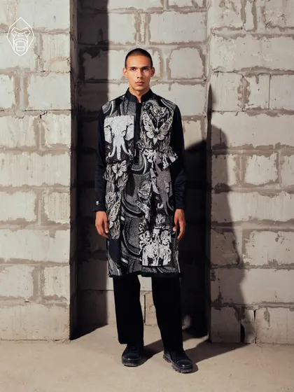 A frontal view of the Mythic Tapestry kurta. This piece is a collage of symbolism and ritual, where folklore motifs like elephants meet modern fashion in a striking noir palette.