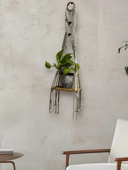 This single-tier wall planter shelf is perfect for a small corner, adding a touch of green without taking up much space.