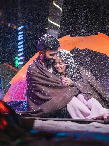 A magical moment during a night camping theme. We used artificial snow to create this cozy, winter-wonderland feeling, even next to a warm bonfire.