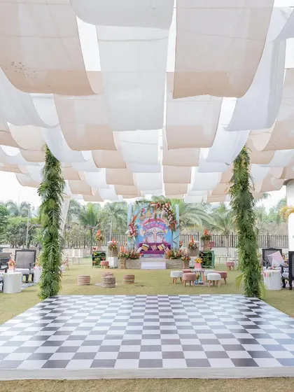 The dance floor and overall setup for the carnival-themed Mehendi, with a checkered floor and flowing drapes creating a fun and inviting atmosphere.