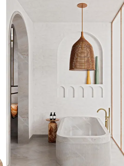 Another view of the serene bathtub nook, where a fluted marble tub and a natural fiber pendant light create a spa-like atmosphere.