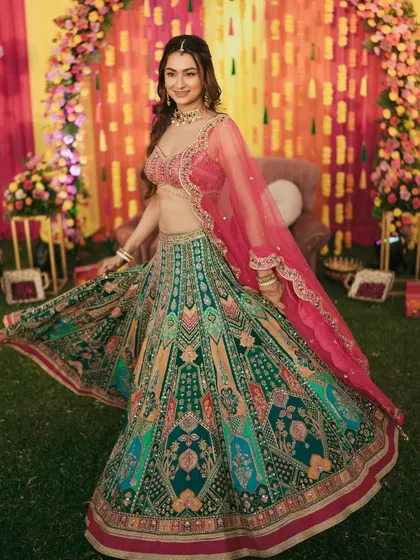 Another beautiful twirl shot, showing the flow and detail of the bride's vibrant Sangeet lehenga.