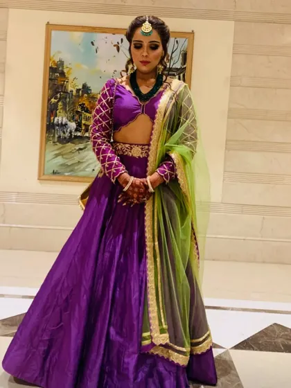 Bringing the bridesmaid glow to life. I styled myself in this stunning purple lehenga with a contrasting green chunni for a wedding function. It's an elegant and eye-catching look perfect for a bridesmaid.