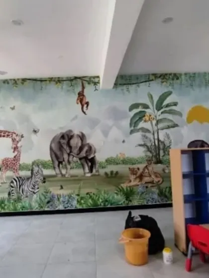 A full-wall jungle safari mural brings a playroom to life with friendly elephants, giraffes, lions, and zebras.