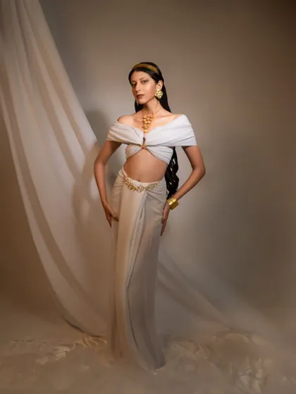 Another look from the Grecian-inspired shoot, focusing on a different pose and styling to showcase the versatility of the model and the jewelry.