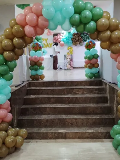 A roaring good time at this dinosaur-themed birthday party! This grand balloon arch in earthy tones of green, brown, and pink created a prehistoric gateway to fun for the little explorer's big day.