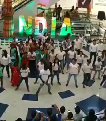 Another angle of our flash mob, showing the scale and the crowd that gathered. These public performances are a powerful way to spread a message and create a shared experience.