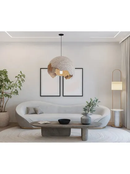 This living room is defined by its organic shapes and textures. The curved sofa, stone-like coffee table, and a statement pendant light made of natural fibers create a serene and earthy ambiance.