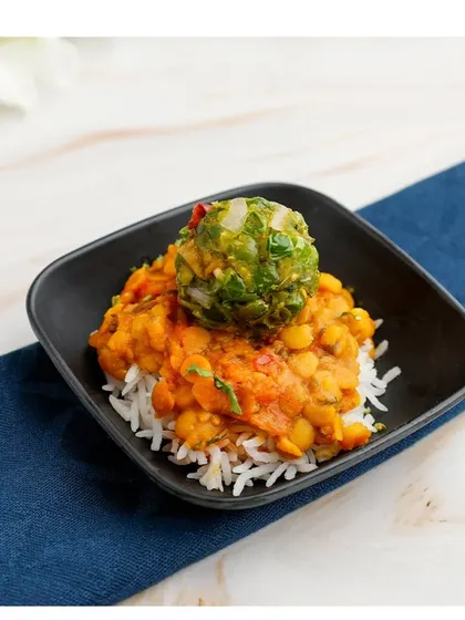 A taste of Bihar, elegantly presented. This dish features Mutter Chokha, a flavourful mash of green peas and spices, served over a bed of rice for a wholesome and comforting bite.