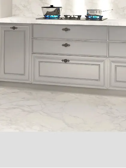 This shot highlights the clean lines and elegant hardware of my classic cabinetry. The simple, raised-panel drawers are paired with vintage-style handles, sitting atop a beautiful marble-patterned floor.