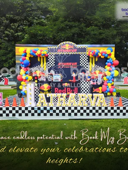 Atharva's birthday was a high-speed Red Bull racing theme. The outdoor setup featured a checkered flag floor, race car driver props, and the iconic Red Bull branding for a party that gives you wings.