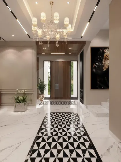This perspective of the grand entrance foyer highlights the seamless flow we create between spaces. The geometric flooring leads the eye through the home, past elegant chandeliers and curated art, promising a journey through a beautifully designed residence.