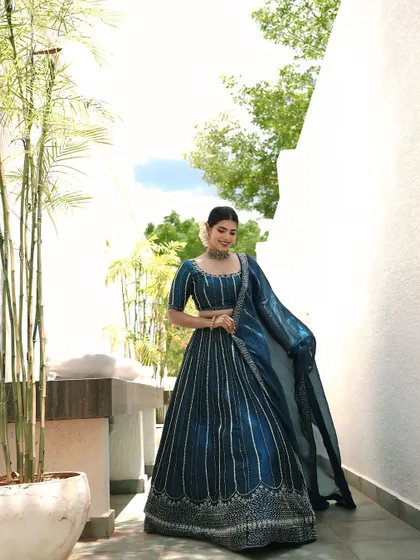 Another beautiful shot of the blue lehenga. The makeup is fresh and modern, perfect for a daytime event or a sangeet.
