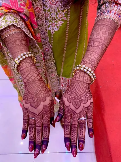 The beautiful, dark stain of a bridal mehendi, shown here with the bride's bangles and rings, a testament to my all-natural henna paste.