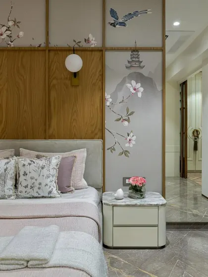 A serene master bedroom by Suvarna Designhouse, featuring our custom Chinoiserie wallpaper set within wood panels. The delicate design adds a touch of artistic sophistication to this calm and luxurious retreat.
