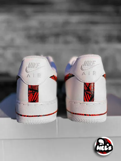 A rear shot of the pair of MotoGP custom Nikes, showing the matching heel designs.