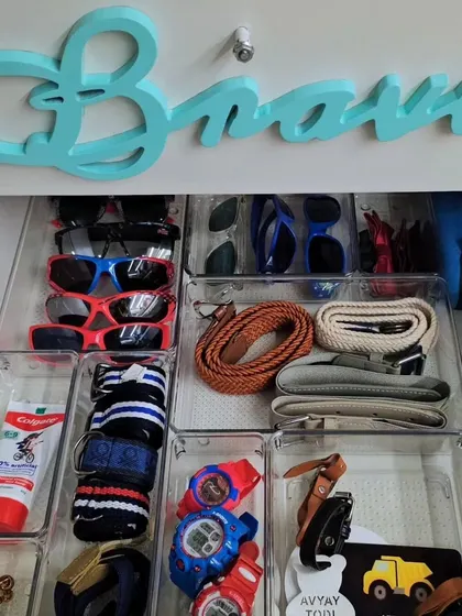 Cool kids' drawers look like this. We use clear bins to organize everything from sunglasses and watches to belts and toothpaste.