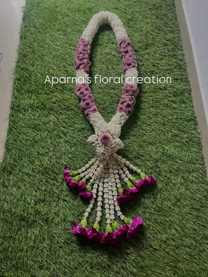 I also create unique, intricately woven Thai-style garlands. The detailed craftsmanship and pattern make this a standout piece, perfect for a special occasion or as a unique varmala.