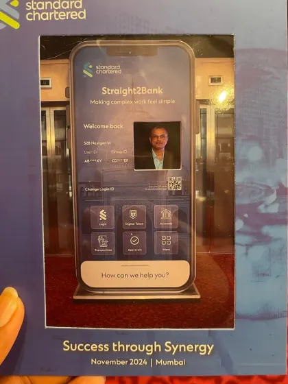 A close-up of the framed souvenir from our custom Selfie Booth for Standard Chartered. The design perfectly mimics the bank's app, creating a clever and highly effective piece of brand reinforcement.