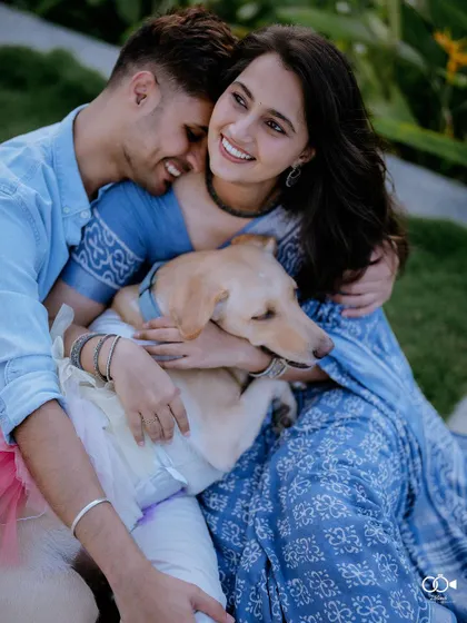 A duplicate of the heartwarming portrait with their dog, a shot that is sure to make any pet lover smile.
