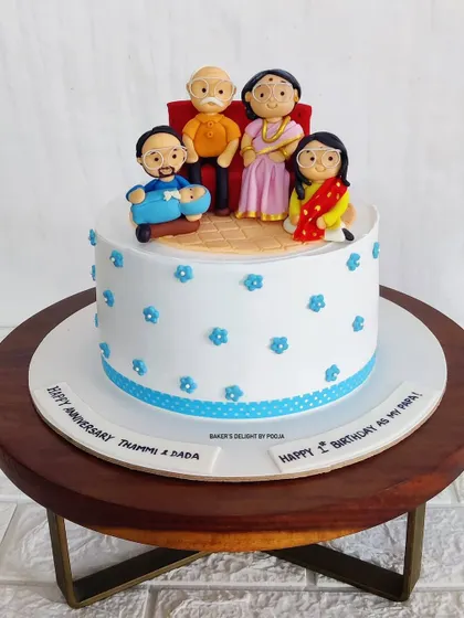 The finished family portrait cake. The simple white and blue design allows the detailed fondant work to be the star of the show.