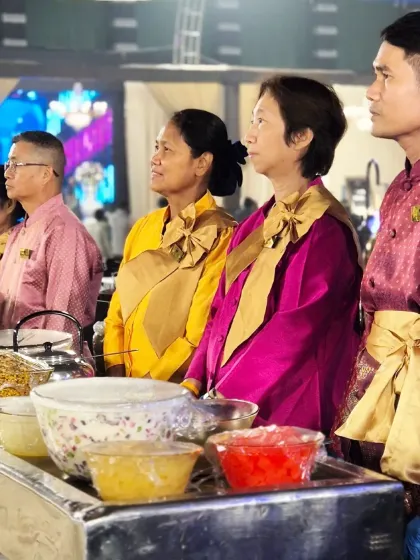 A side view of our international culinary team, attentively watching the event unfold. They are always ready and waiting to provide guests with a taste of their home cuisine.