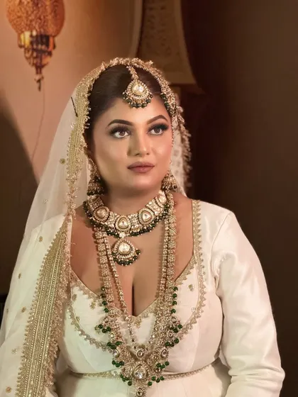 Another portrait from the Umrao Jaan series. The makeup is soft and ethereal, with a focus on the expressive eyes.