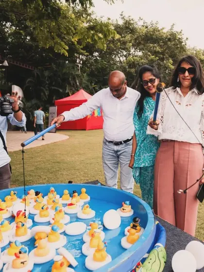 Adults getting in on the fun with a "hook a duck" game. My parties are designed to be enjoyable for everyone, not just the kids.
