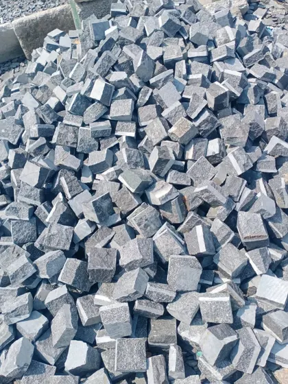 This is my stock of black granite cobblestones. They provide a bold, modern look for driveways and pathways.