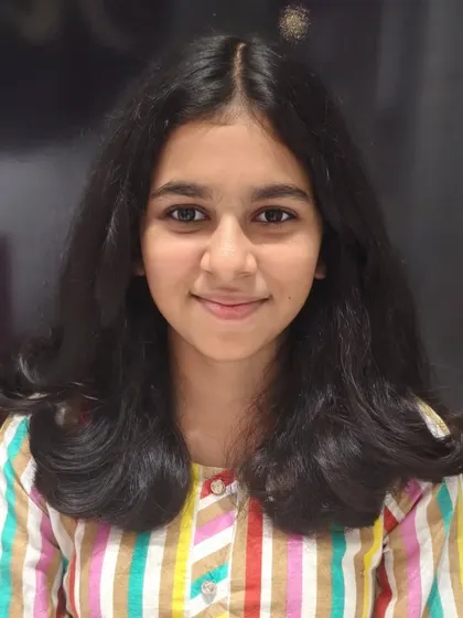 This princess is ready to shine with her new haircut, featuring soft, bouncy curls at the ends.