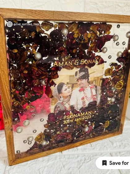 The combination of dark wood, red roses, and a white background creates a classic and timeless look.