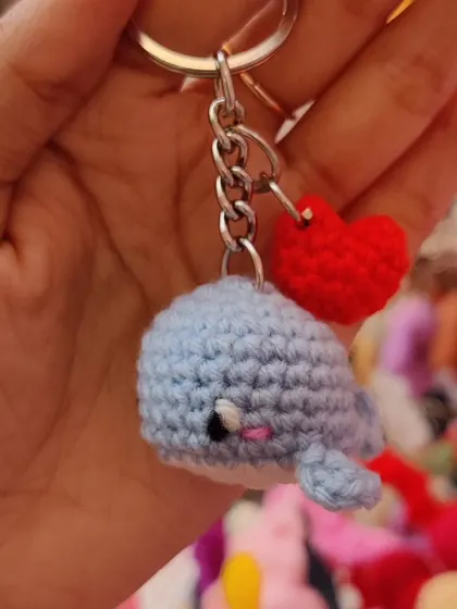 A tiny blue whale keychain with a heart charm.