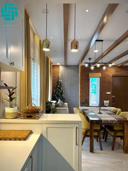 This open-plan space seamlessly connects the kitchen, dining, and living areas. I used wooden ceiling beams and a brick accent wall to add warmth and texture.